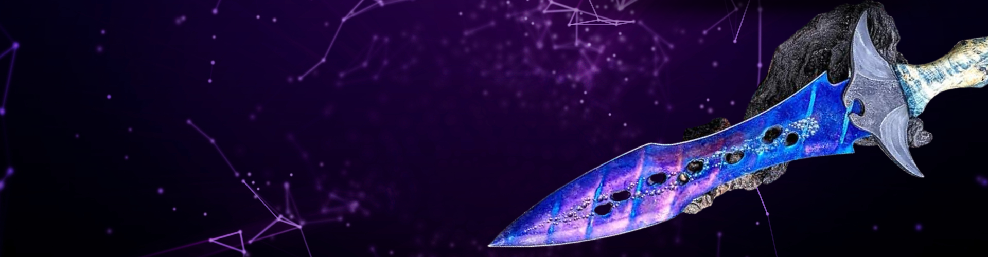 Dague Manta violette et bleu électrique posée sur un rocher