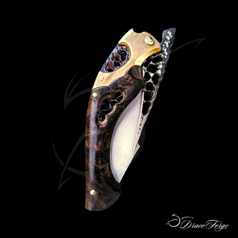 Neptune X Amphipthère couteau pliant artisanal ajouré dentelle d'acier loupe de laurel Dracoforge