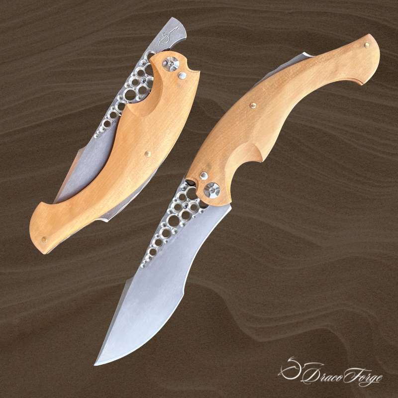Amphiptère 32 couteau pliant piémontais artisanal ajourages circulaire manche buis Dracoforge Amphiptère 32 couteau pliant piémontais artisanal ajourages circulaire manche en buis Dracoforge